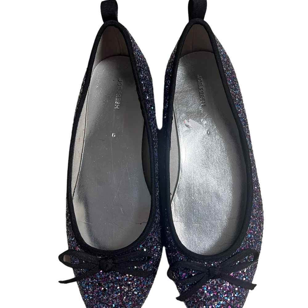 A pair of colourful glitter shoes in size 5